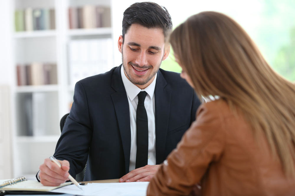 Woman meeting financial adviser in office Woman meeting financial adviser in office